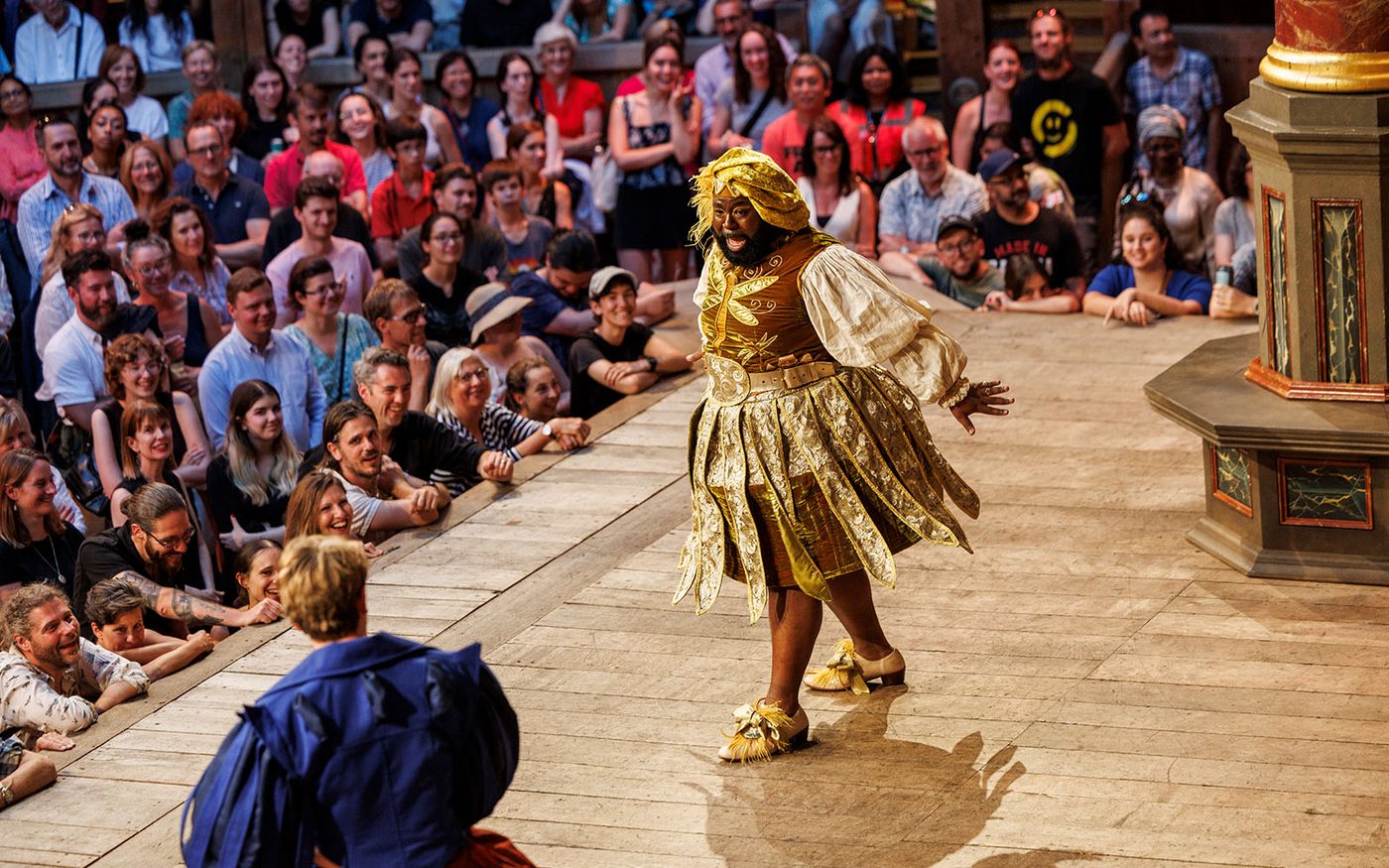 Two actors onstage in front of an audience