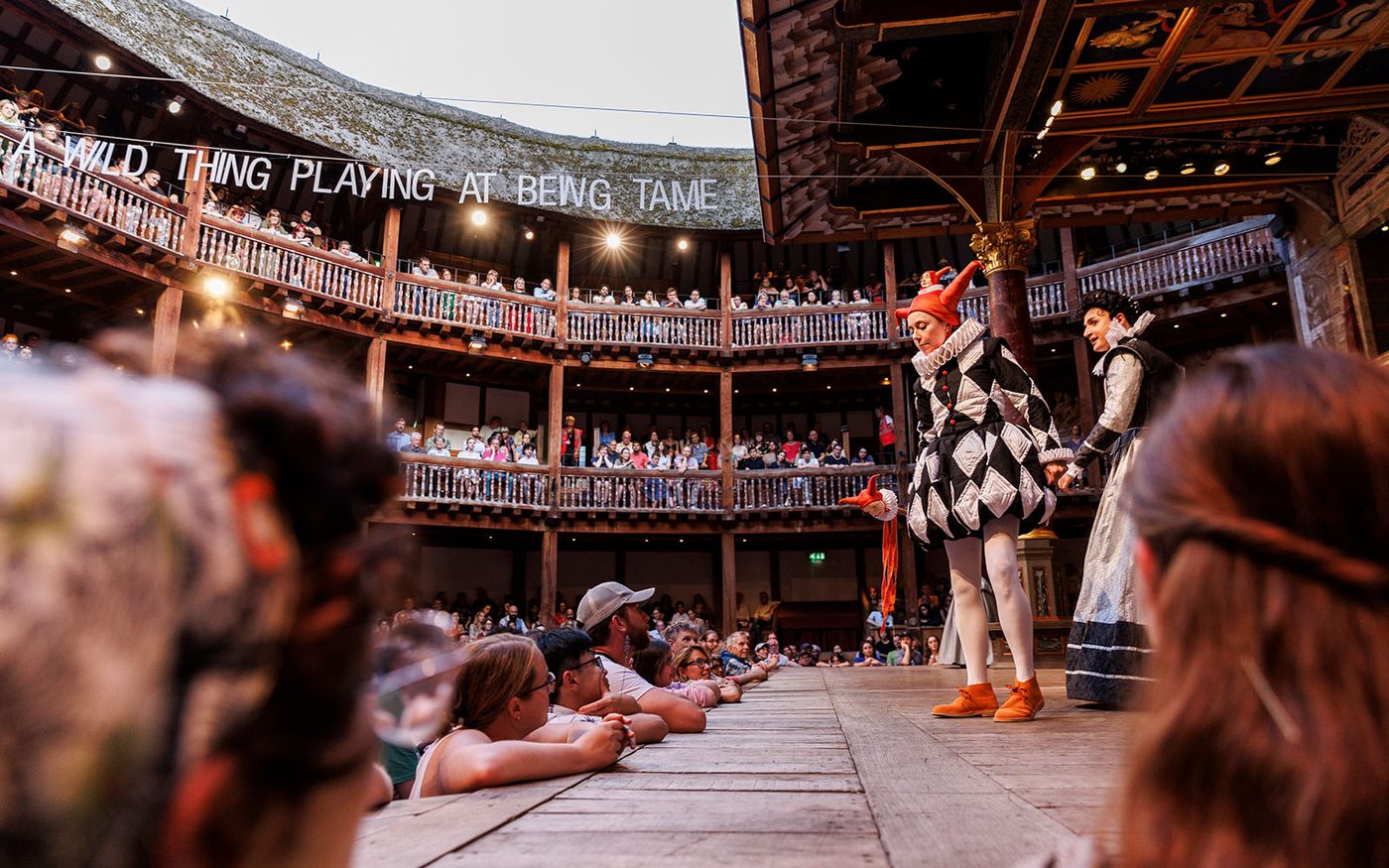 Two actors onstage in front of an audience