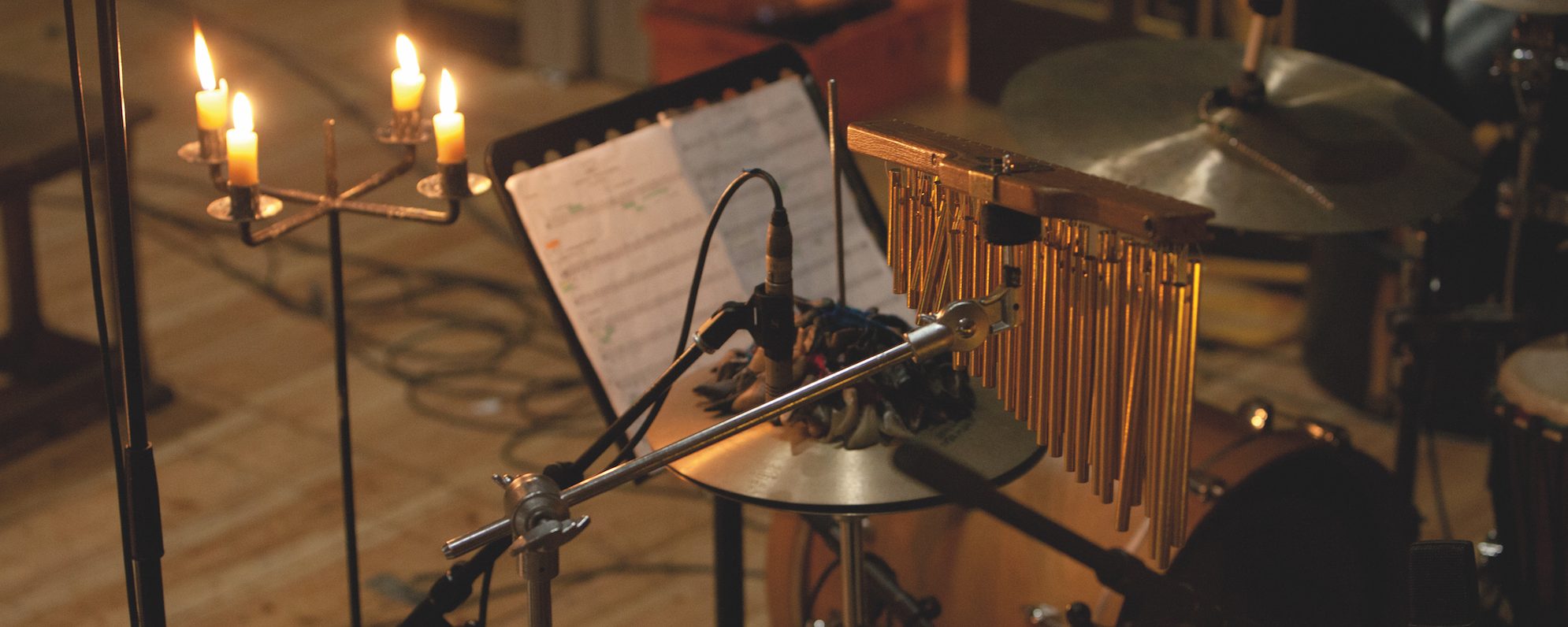 Instruments sit in a dark theatre