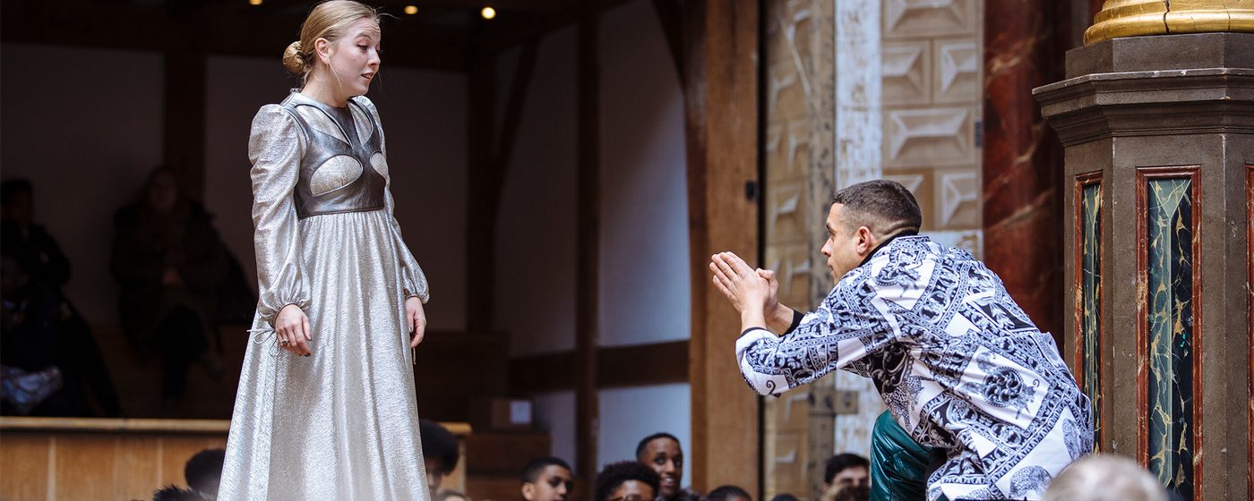 Romeo kneels to Juliet upon meeting her, his hands are clasped together