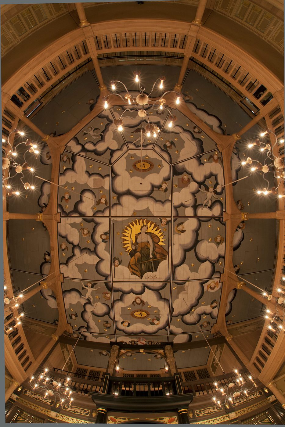 A decorated ceiling with candles