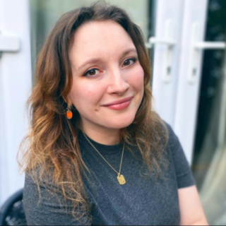 Headshot of Emily Rowe smiling at the camera