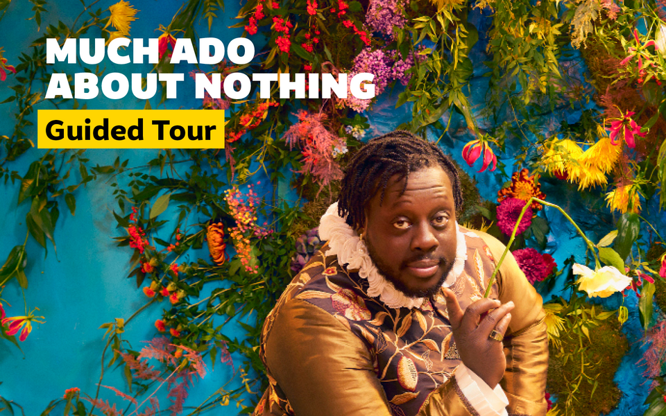 Closeup of Ekow Quartey sat in front of a flower wall adorning a blue background holding a broken white rose. Overlaid text reads Much Ado About Nothing Guided Tour.